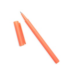 One orange marker and cap on white background, top view