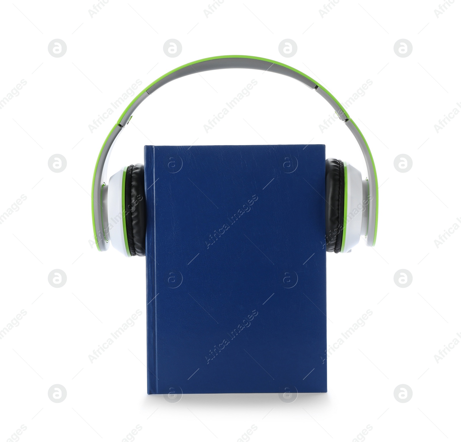 Photo of Modern headphones with hardcover book on white background