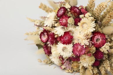 Photo of Beautiful bouquet of dry flowers on white background, closeup. Space for text