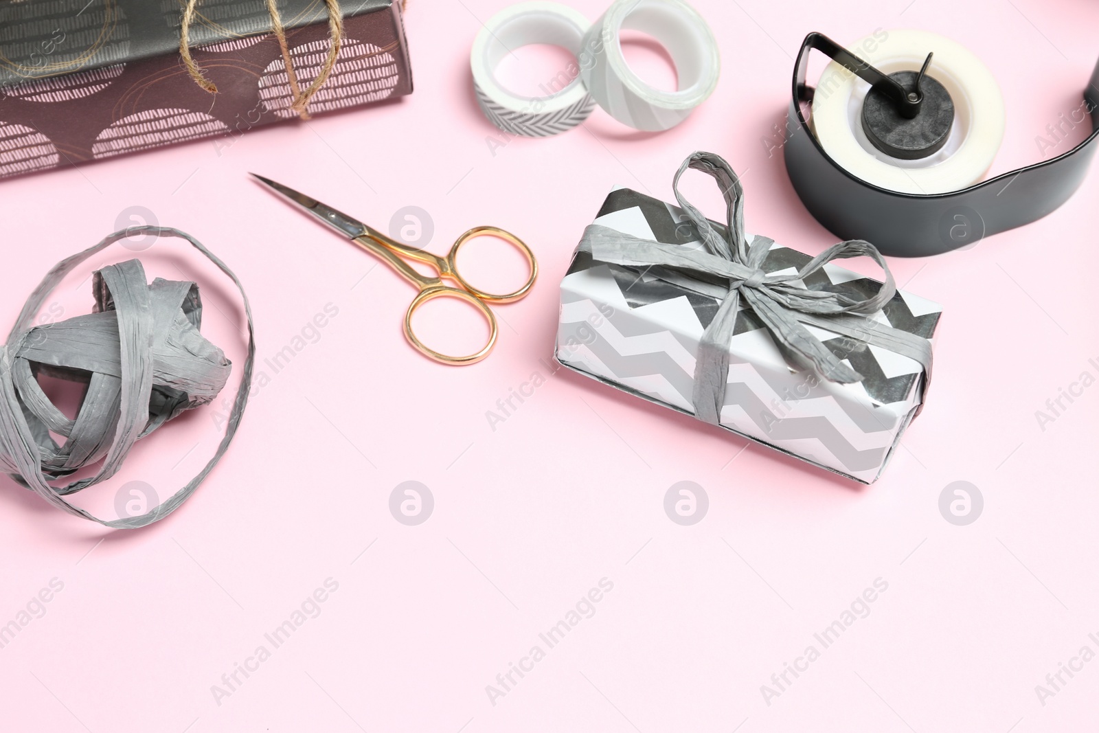 Photo of Beautiful gift box and tools for decor on color background. Space for text