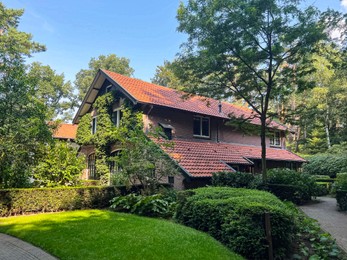 Photo of Beautiful view of house and garden on sunny day