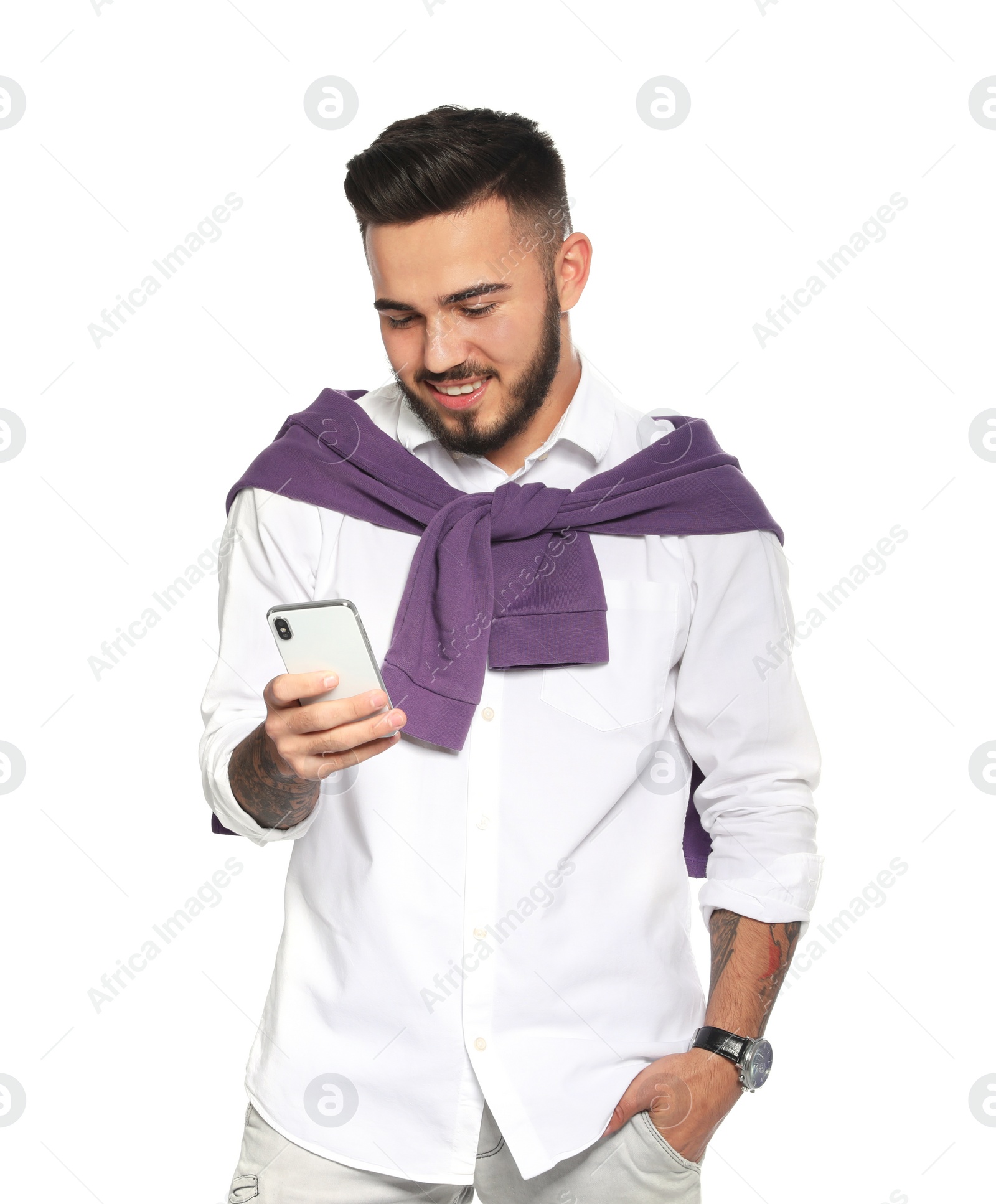 Photo of Portrait of handsome young man with mobile phone on white background