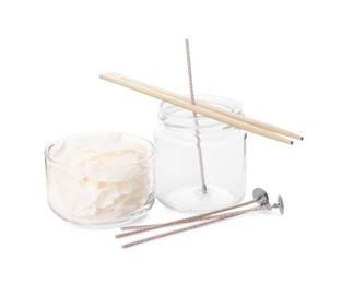 Photo of Wax flakes, wicks and jar with chopsticks as stabilizer on white background. Making homemade candle