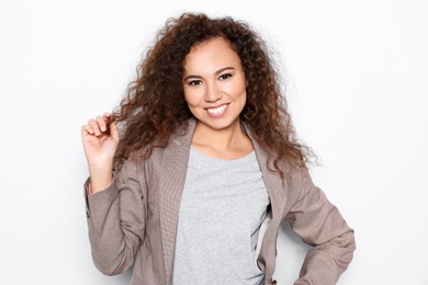 Young African-American woman with beautiful face on white background