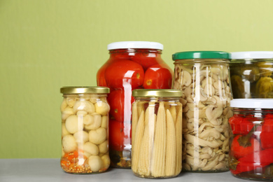 Jars of pickled vegetables on light table