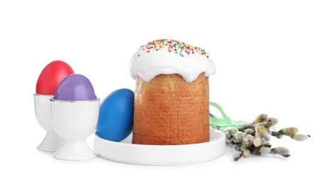 Photo of Traditional Easter cake, pussy willows and colorful eggs on white background