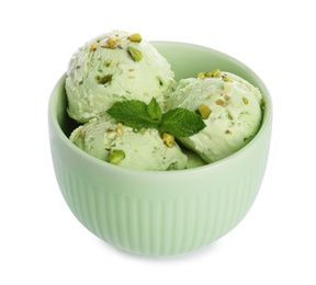 Photo of Bowl of delicious pistachio ice cream with mint on white background