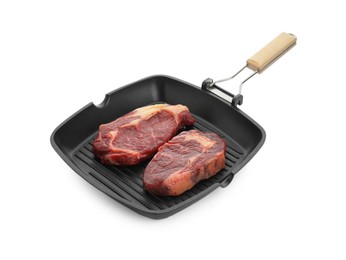 Grill pan with pieces of fresh beef meat isolated on white