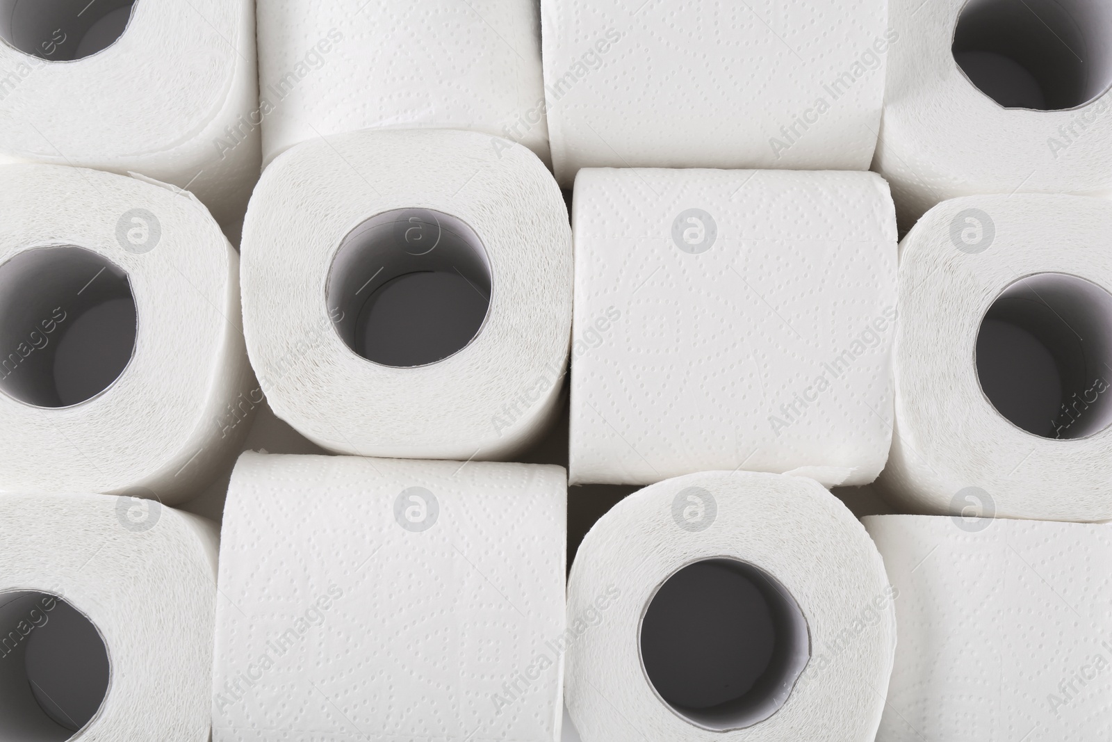 Photo of Many soft toilet paper rolls as background, above view