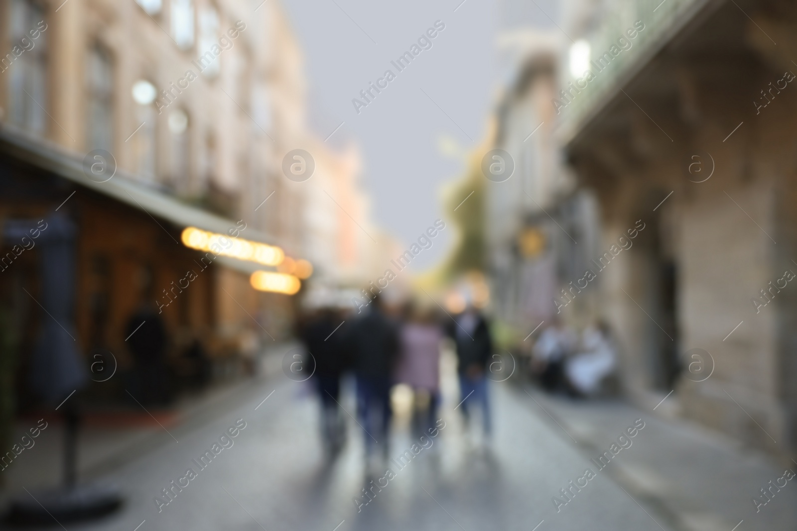 Photo of Blurred view of people walking on city street