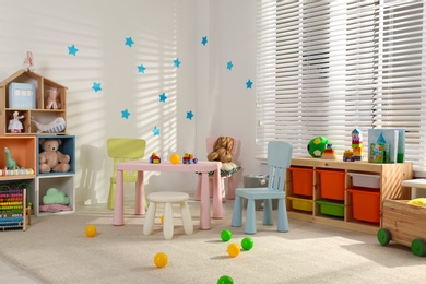 Cozy baby room interior with stylish furniture