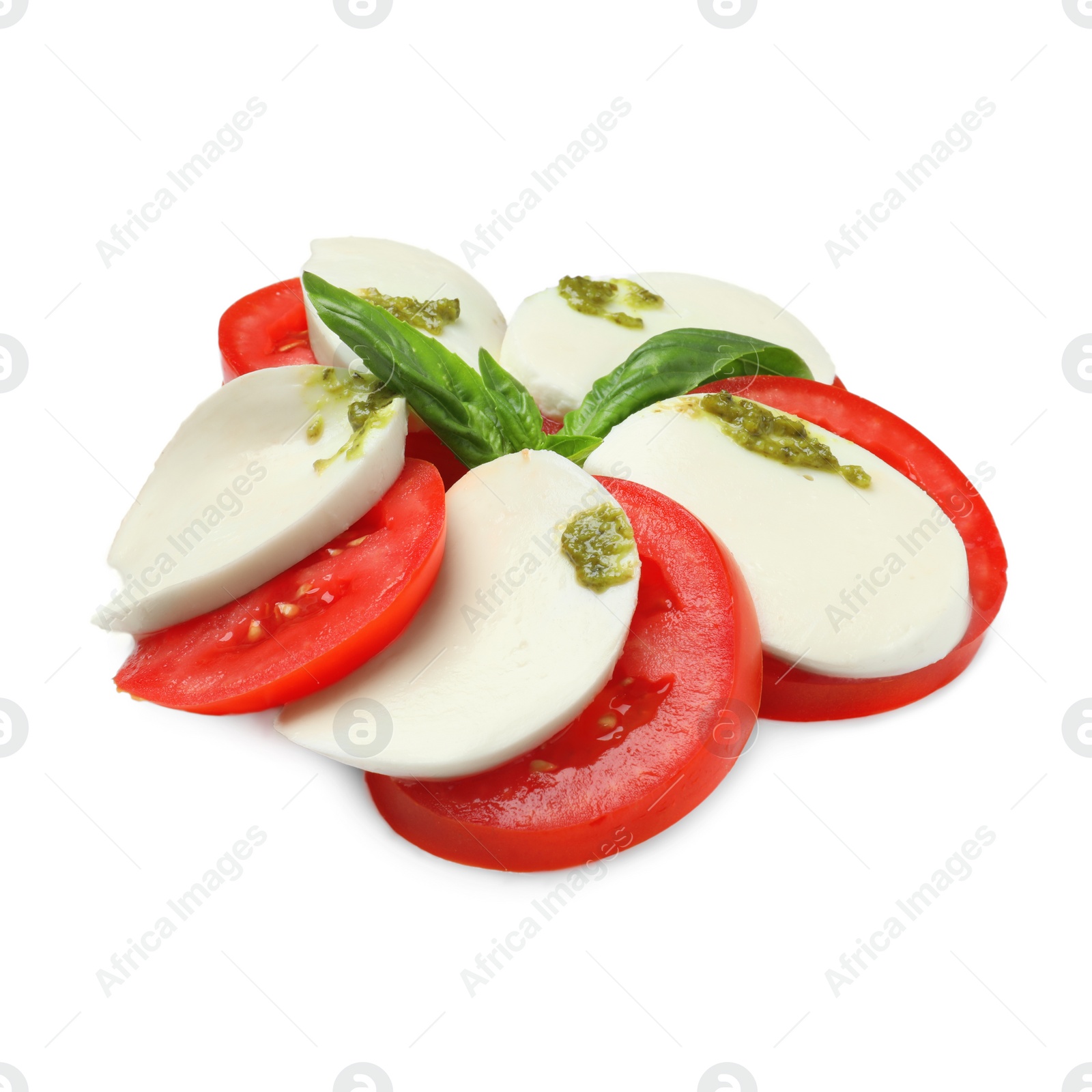 Photo of Tasty salad Caprese with mozzarella, tomatoes, basil and pesto sauce isolated on white