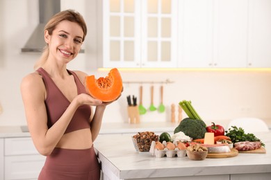 Photo of Woman with healthy food in kitchen. Keto diet