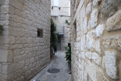 Photo of Picturesque view of passage between old buildings in city
