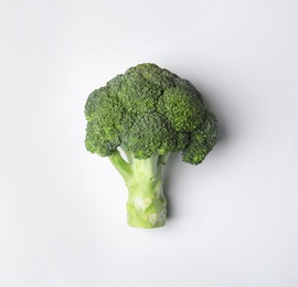 Photo of Fresh green broccoli on color background, top view. Organic food