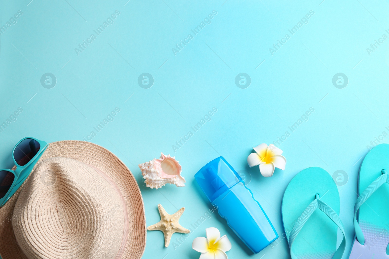 Photo of Flat lay composition with beach accessories on color background. Space for text