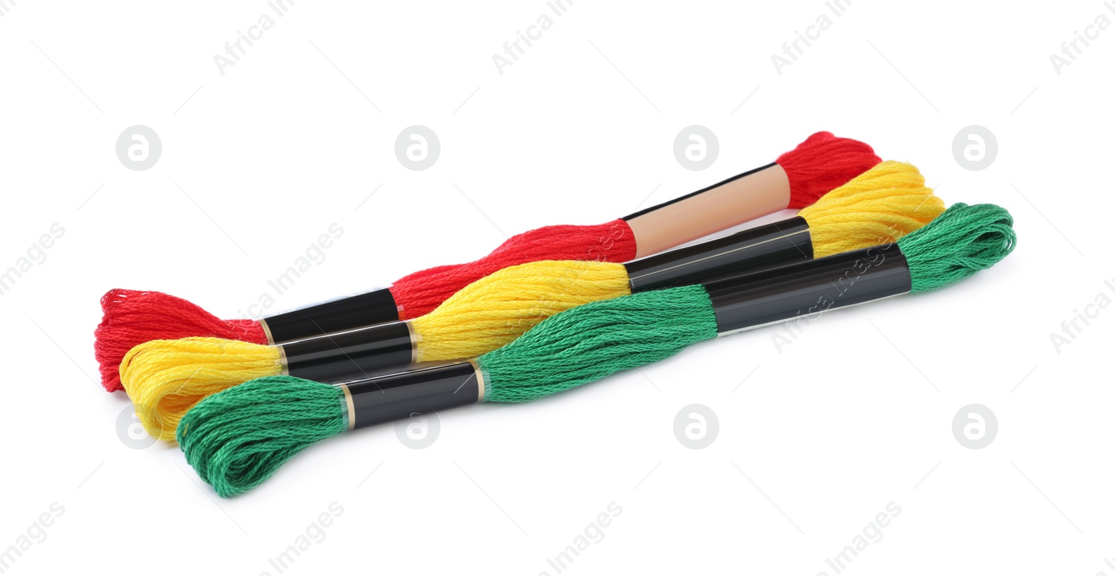 Photo of Set of colorful embroidery threads on white background