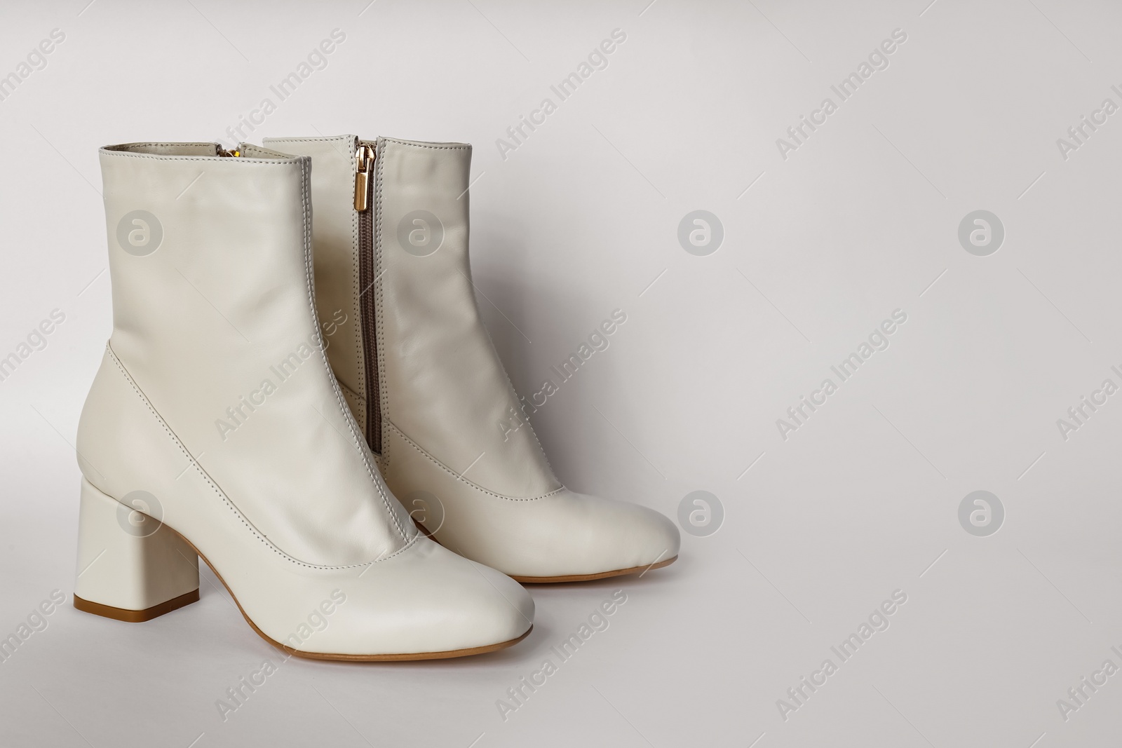 Photo of Pair of stylish leather shoes on white background, space for text