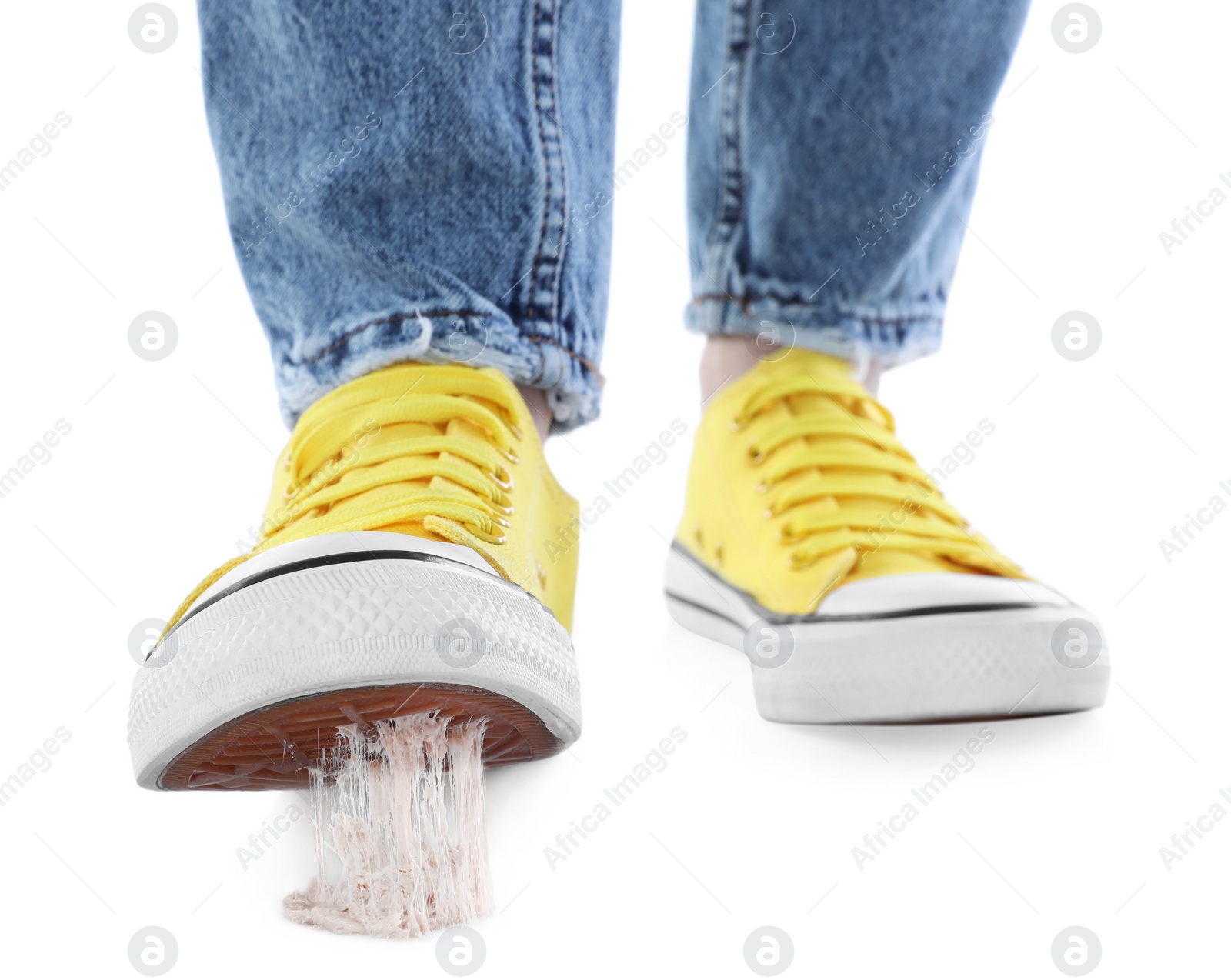 Photo of Person stepping into chewing gum on white background, closeup