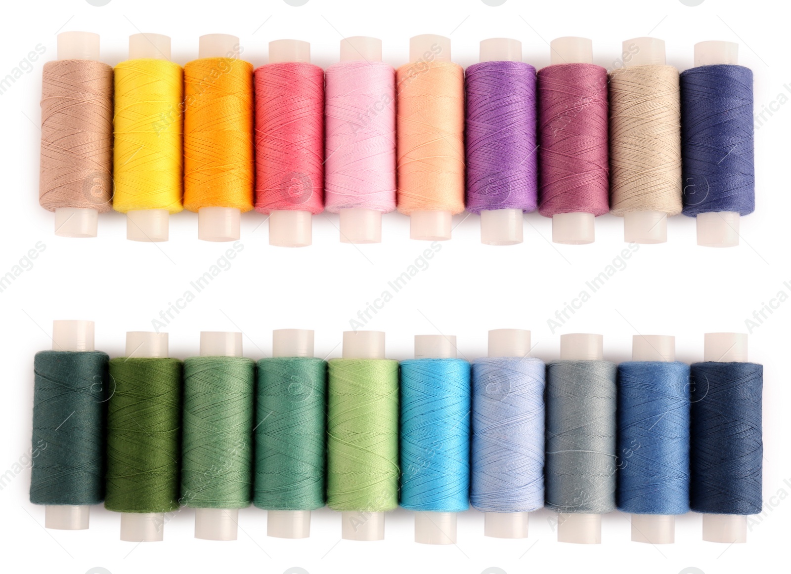 Photo of Set of colorful sewing threads on white background, top view