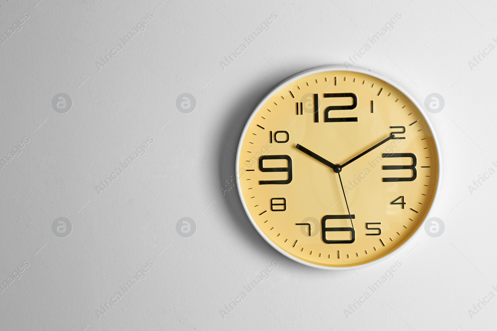 Photo of Stylish clock and space for text on light background. Time management