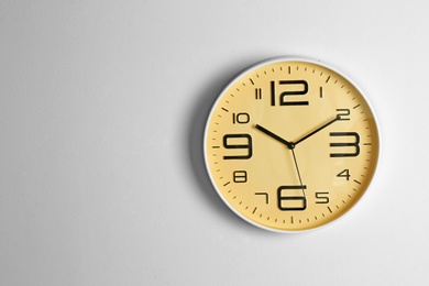 Photo of Stylish clock and space for text on light background. Time management