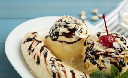 Photo of Delicious dessert with banana ice cream on table, closeup
