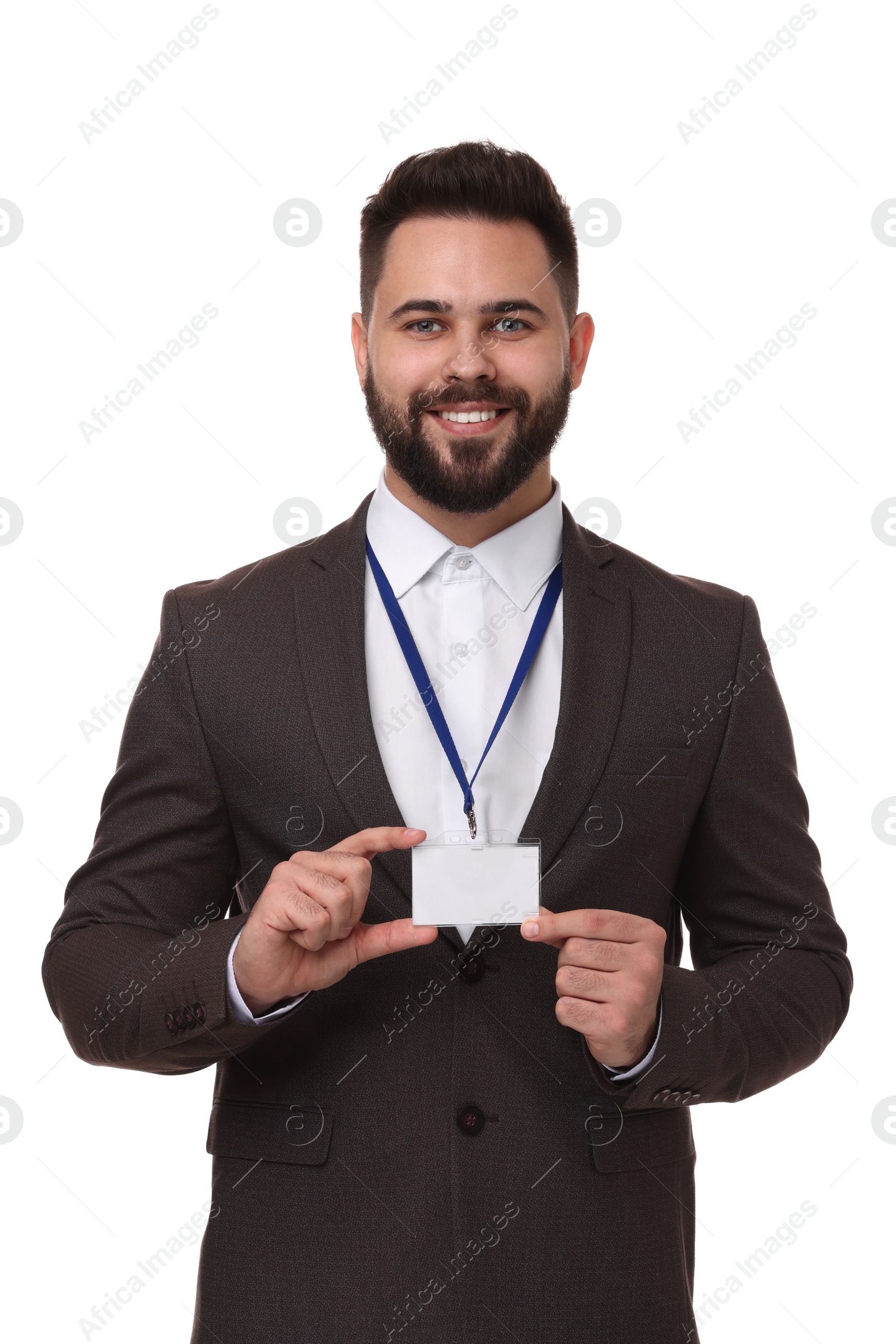 Photo of Happy young man with blank badge isolated on white