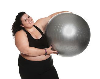 Overweight woman with fit ball on white background