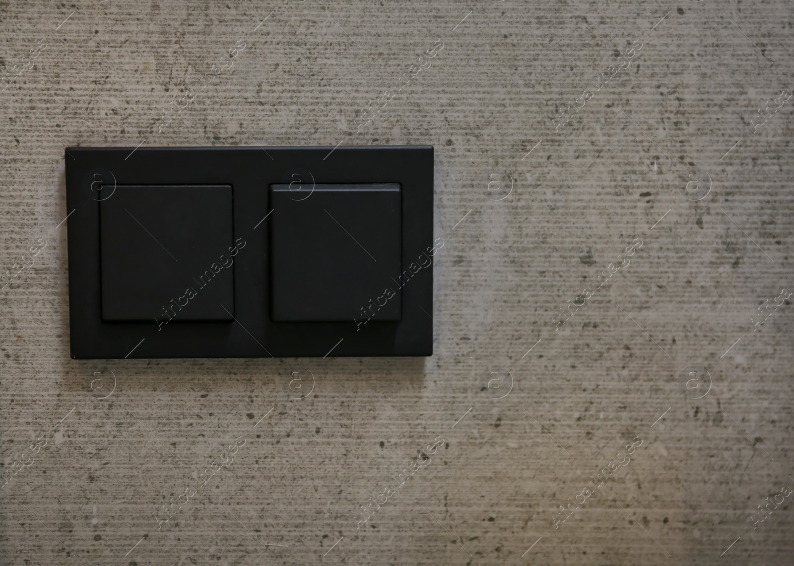 Photo of Light switches on wall. Space for text