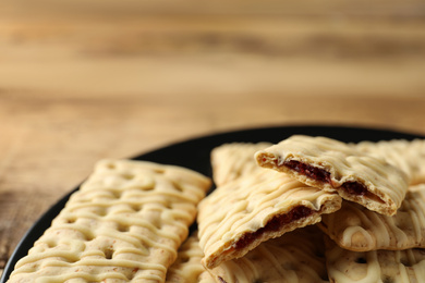 Tasty cookies with filling on table, closeup