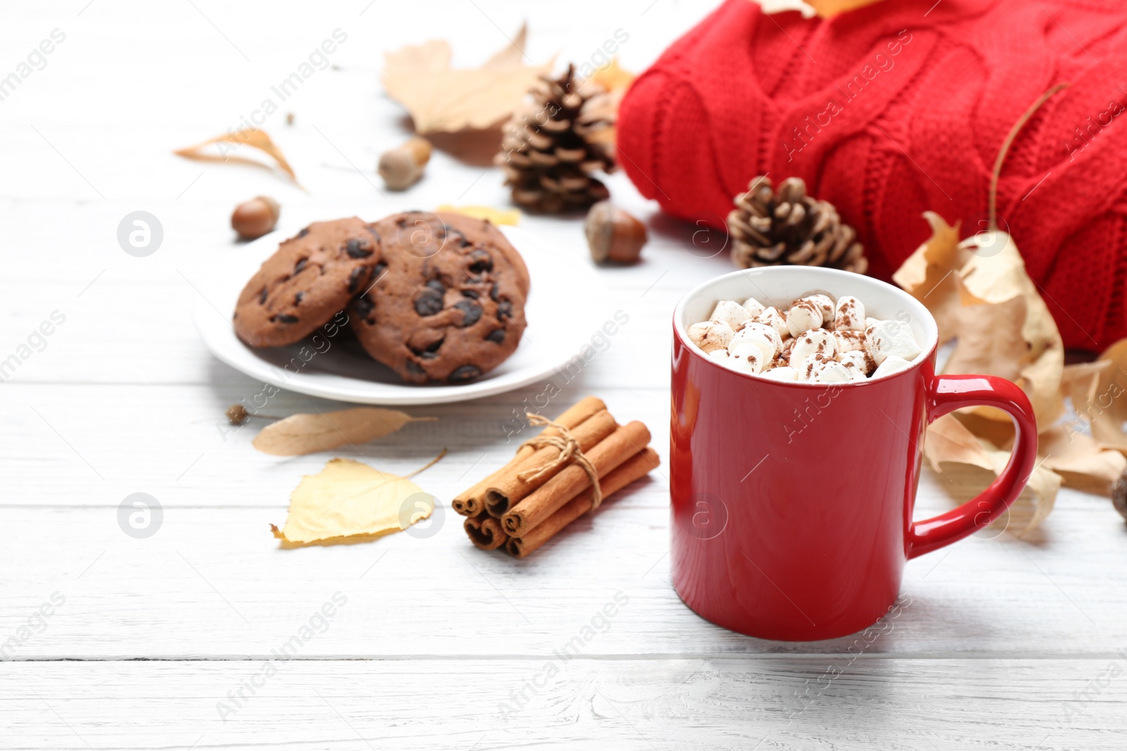 Photo of Cup of hot drink and cookies on white wooden table. Cozy autumn atmosphere