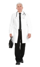 Full length portrait of male doctor with briefcase isolated on white. Medical staff