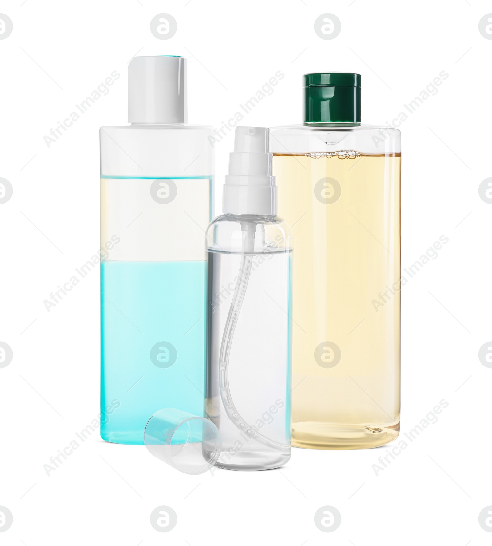 Photo of Bottles of micellar cleansing water on white background