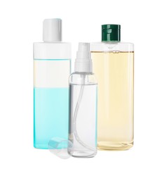 Bottles of micellar cleansing water on white background