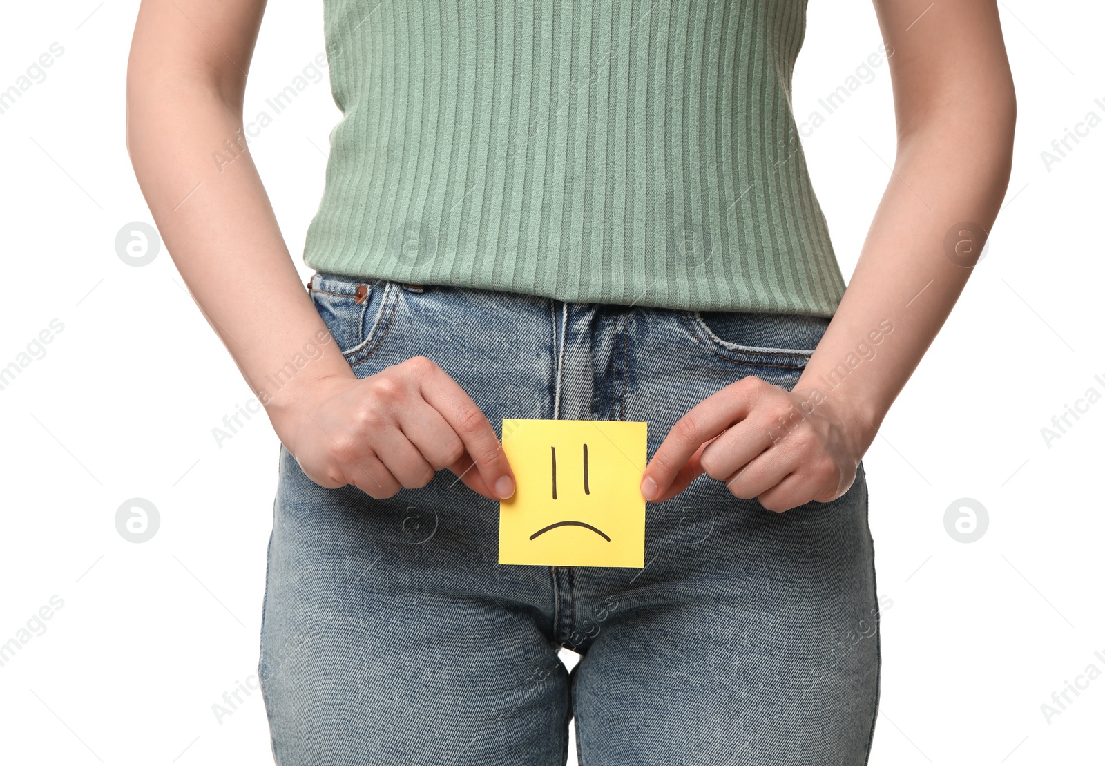 Photo of Cystitis. Woman holding sticky note with drawn sad face on white background, closeup