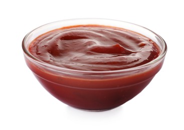 Photo of Tasty ketchup in glass bowl isolated on white