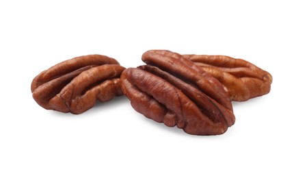 Three tasty pecan nuts isolated on white