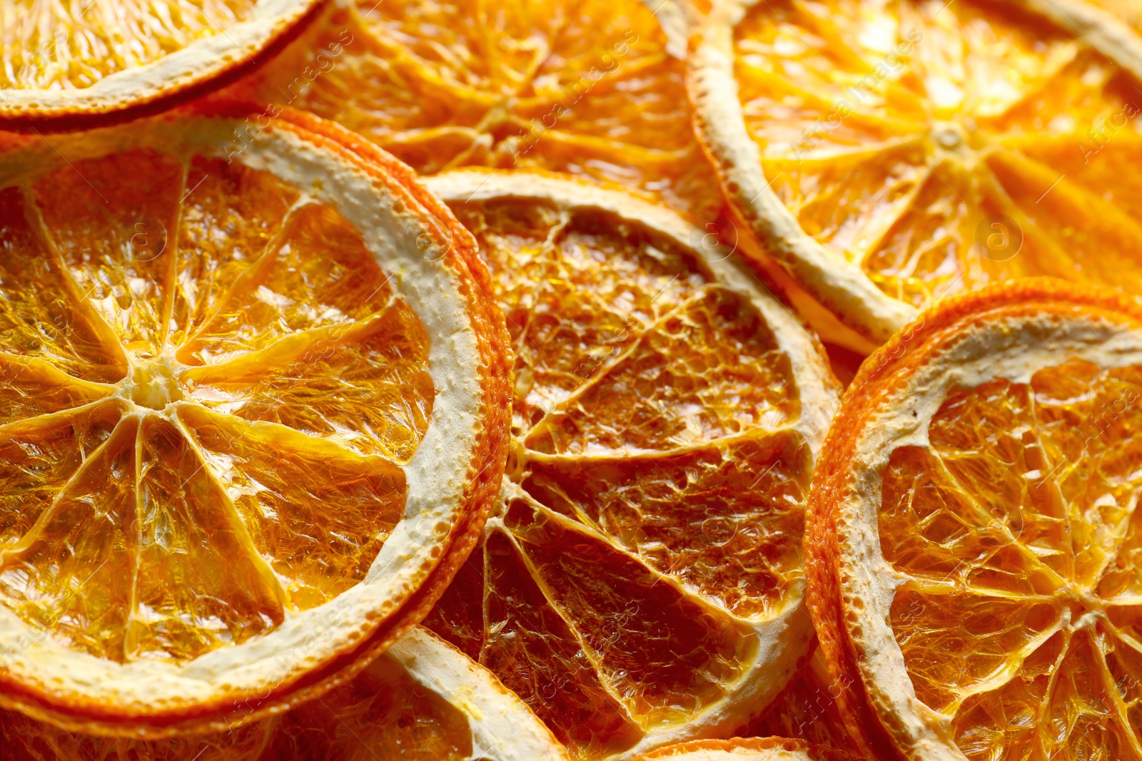 Photo of Many dry orange slices as background, top view