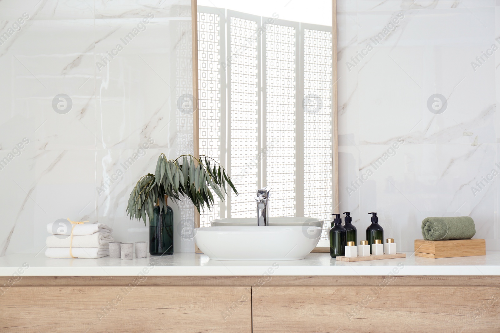 Photo of Modern bathroom interior with stylish mirror and vessel sink