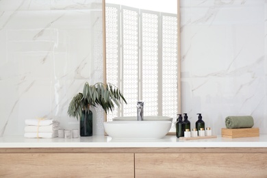 Modern bathroom interior with stylish mirror and vessel sink