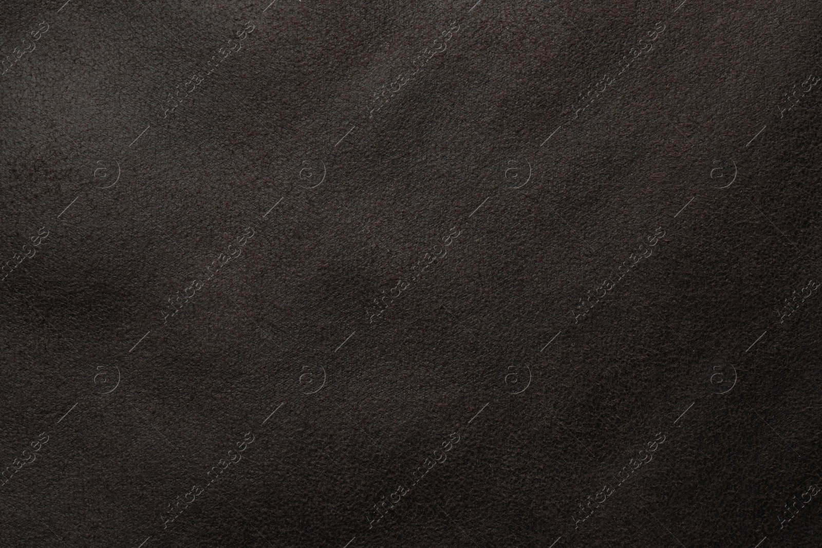 Photo of Texture of brown suede fabric as background, top view