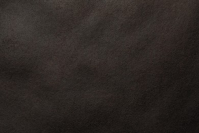 Photo of Texture of brown suede fabric as background, top view