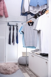 Photo of Modern dressing room with different stylish clothes and accessories