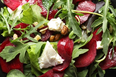 Delicious salad with beet as background, closeup