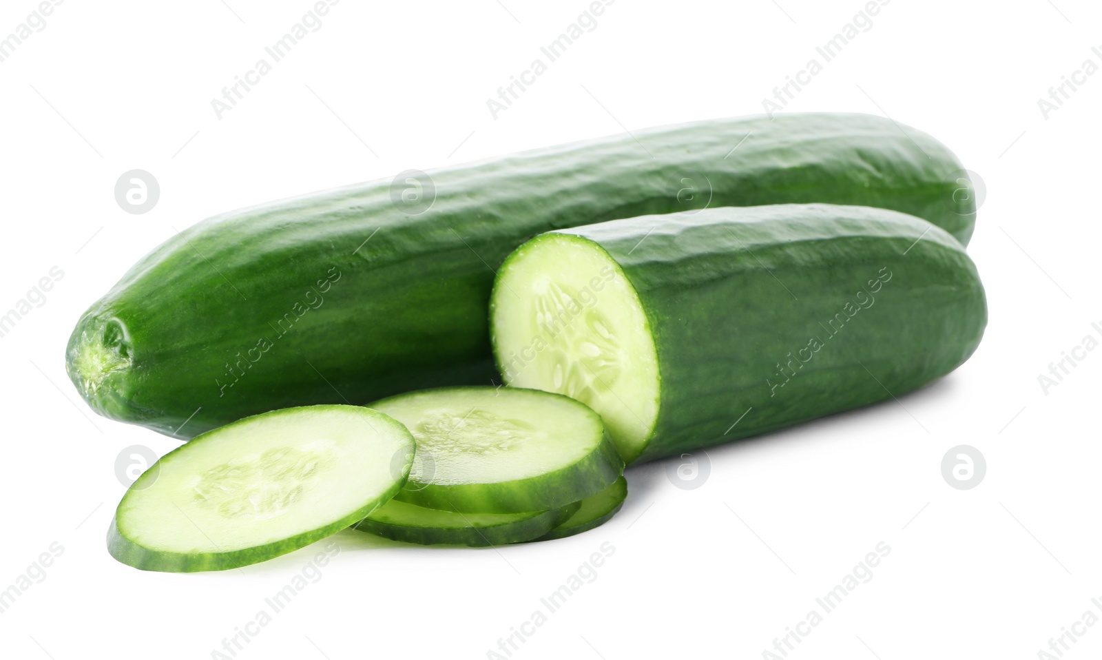 Photo of Whole and sliced fresh cucumbers on white background