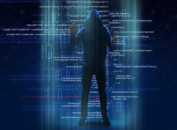 Man in hood and digital code on dark background. Cyber attack concept