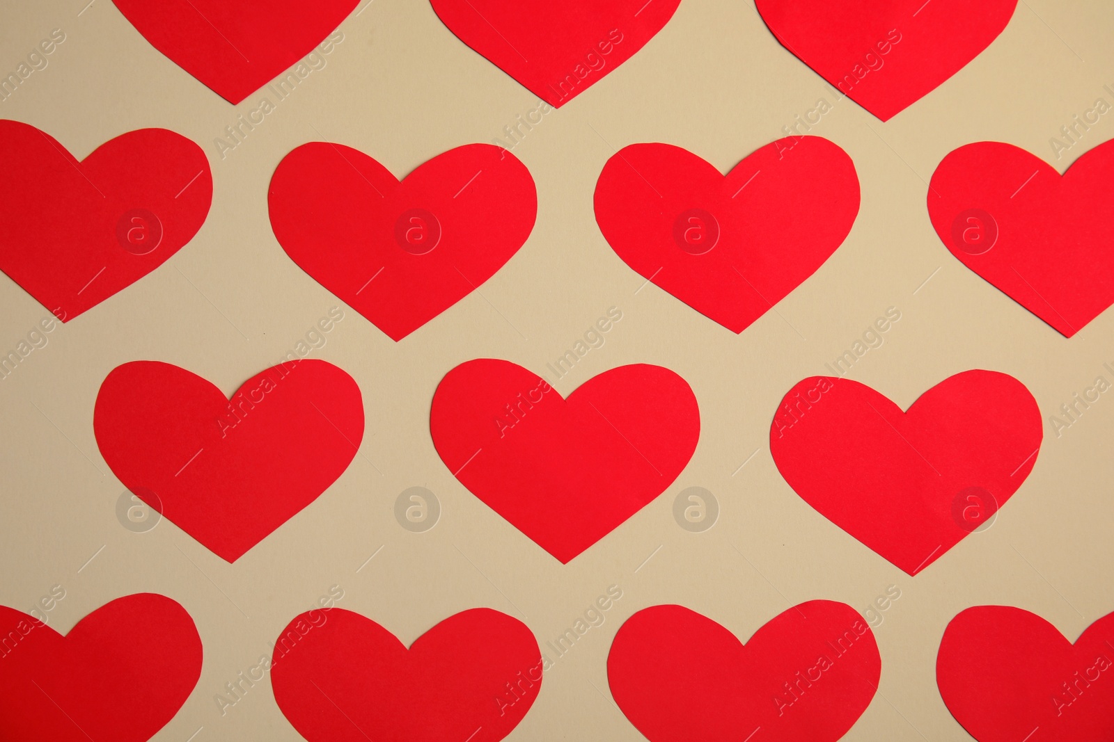 Photo of Small paper hearts on color background, top view