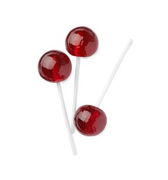 Photo of Many sweet red lollipops isolated on white, top view