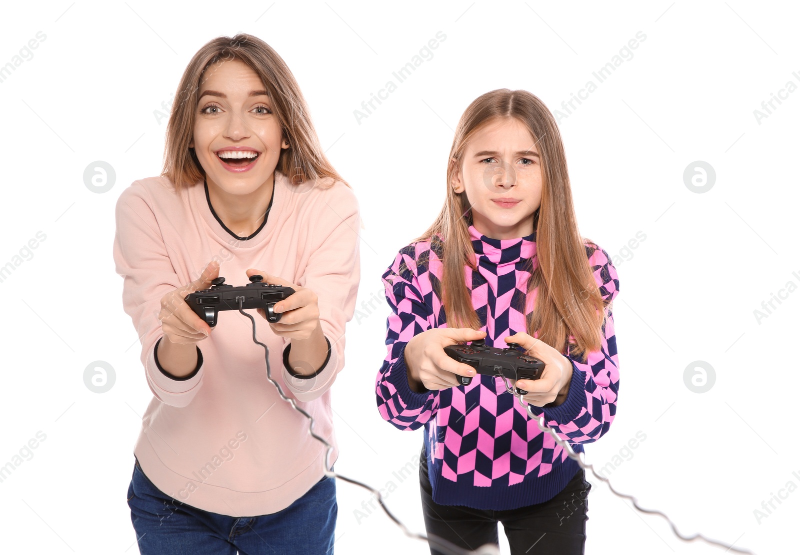 Photo of Young woman and teenage girl playing video games with controllers isolated on white